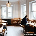 스웨덴에서 금기시되는 행동 - **Prompt 1: A serene "Fika" moment embodying "Lagom" and discretion.**
    "A cozy and tastefully de...